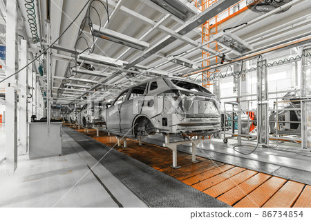 Plant for production of cars. Modern automotive industry. Electric car factory, conveyor 86734854