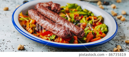 veggie sausages and grilled vegetables, web banner 86735819
