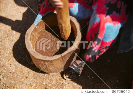 african workers are picking out fresh coffee beans at washing station 86736043