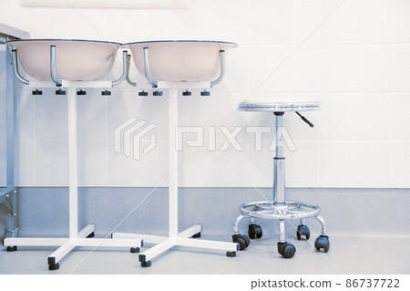 Empty interior operating room and modern equipment in hospital. Medical device for surgeon surgical emergency patient in blue tone style. Save life medical treatment concept. Empty interior operating room and modern equipment in hospital. Medical device for surgeon surgical emergency patient in blue tone style. Save life medical treatment concept. 86737722