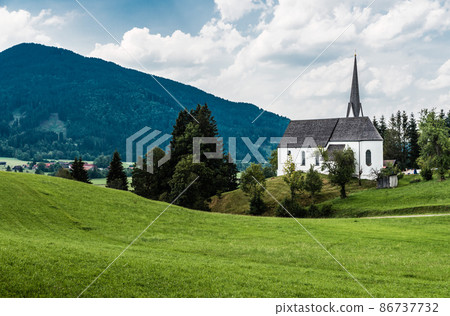 Scenic view of a chapel and green hills over the German countryside in the village Kappel Scenic view of a chapel and green hills over the German countryside in the village Kappel 86737732