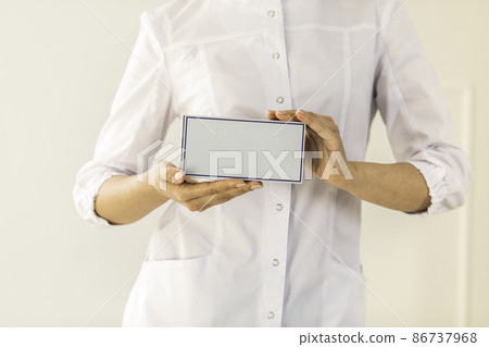 Doctor hand showing drug boxes at Office Desktop. Health care, Medical Concept. Doctor hand showing drug boxes at Office Desktop. Health care, Medical Concept. 86737968