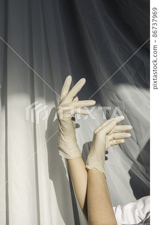 Nurse's hands in rubber gloves preparing an ampoule for injection. Vaccines Used for prevention, immunity and treatment from covid-19 infection or coronavirus. 86737969
