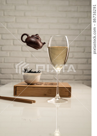 tea table with appliances and a wine glass in which tea is brewed tea table with appliances and a wine glass in which tea is brewed 86738291