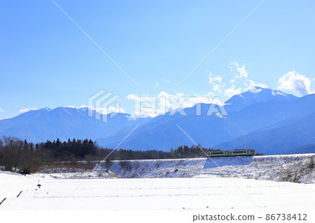 Koumi Line and Southern Alps going through the snowy landscape Koumi Line and Southern Alps going through the snowy landscape 86738412