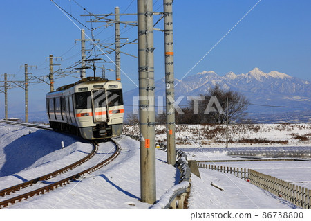 Minobu Line and Yatsugatake going through the snowy landscape Minobu Line and Yatsugatake going through the snowy landscape 86738800
