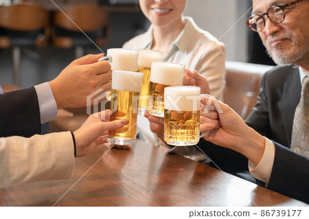 A launch party on the way home from work to toast with beer 86739177