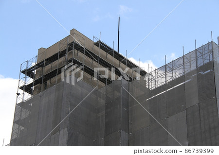 Municipal Imafukuminami Housing Building No. 4 with scaffolding and exterior wall construction under construction 86739399