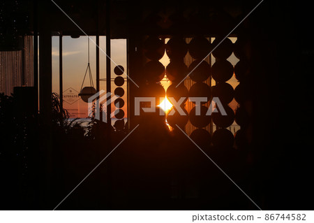 Bright sunset photo with silhouettes of people 86744582