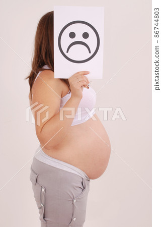 Pregnant female with frowning face card. Pregnant female with frowning face card. 86744803