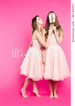 Girlfriends wearing in dresses having fun and 86744943