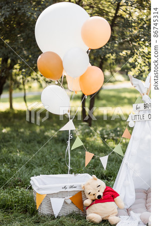 Colorful balloons, toys and teepee tent standing on outdoors 86745314