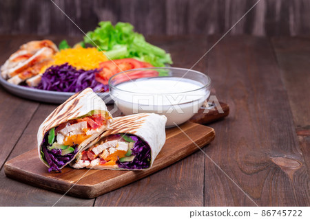 Grilled chicken wraps, horizontal, copy space 86745722