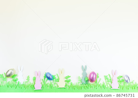Yellow paper texture with green felt grass, bunny and colorful eggs, Easter background, horizontal, copy space Yellow paper texture with green felt grass, bunny and colorful eggs, Easter background, horizontal, copy space 86745731