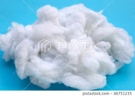 Polyester stable fiber on blue background. 86751235