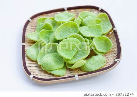 Prawn crackers in bamboo basket. Shrimp crispy rice snack Prawn crackers in bamboo basket. Shrimp crispy rice snack 86751274