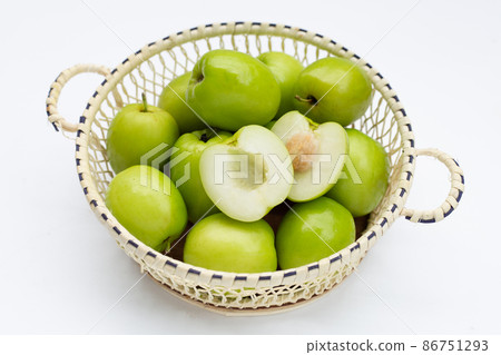 Milk jujube in basket on white Milk jujube in basket on white 86751293