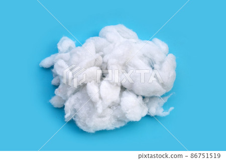 Polyester stable fiber on blue background. Polyester stable fiber on blue background. 86751519
