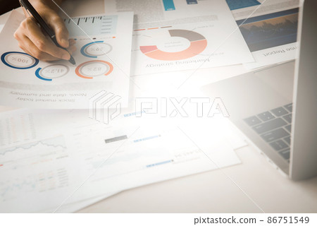 Businessman analyzing investment charts with laptop. Accounting and Business concept 86751549