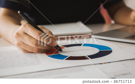 Businessman analyzing investment charts with laptop. Accounting and Business concept 86751713