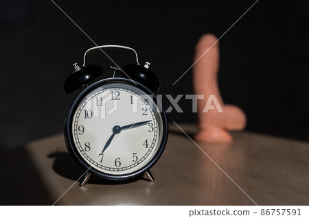 Time for carnal pleasures. Alarm clock and dildo made of cyber leather. Naturalistic vibrator for masturbation. Time for carnal pleasures. Alarm clock and dildo made of cyber leather. Naturalistic vibrator for masturbation. 86757591