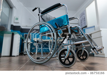 Empty office space with nobody in it having medical wheelchair Empty office space with nobody in it having medical wheelchair 86758166