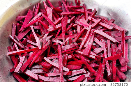 large pieces of beets are fried in a pan large pieces of beets are fried in a pan 86758170