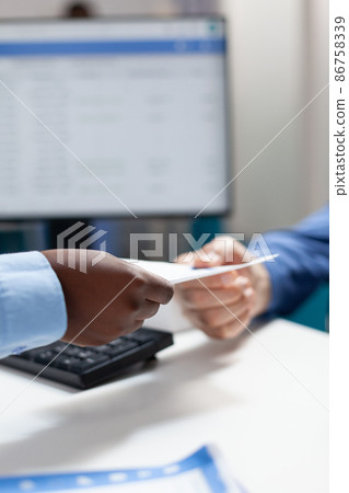 Closeup of african american therapist doctor woman giving paper with medication prescription 86758339