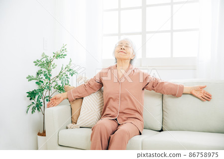 Elderly woman getting up 86758975