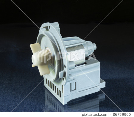 Washing machine pump on blue table with reflection Washing machine pump on blue table with reflection 86759900