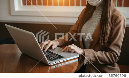 Working Process in Modern Office. Young Woman Account Manager Working at Wood Table with New Business Project. Typing keyboard,Using Contemporary Laptop. Horizontal. Working Process in Modern Office. Young Woman Account Manager Working at Wood Table with New Business Project. Typing keyboard,Using Contemporary Laptop. Horizontal. 86760896