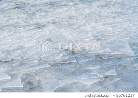The surface of the lake where the ice broke and overlapped The surface of the lake where the ice broke and overlapped 86761237