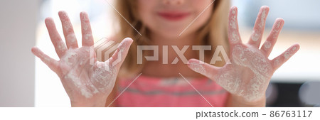 Little girl shows hands in flour. Cooking class for children Little girl shows hands in flour. Cooking class for children 86763117