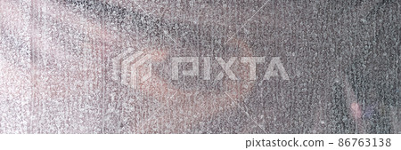 Dirty glass of window with many white dried drops closeup Dirty glass of window with many white dried drops closeup 86763138