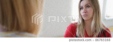 Female doctor communicates with patient in bleach corridor Female doctor communicates with patient in bleach corridor 86763168