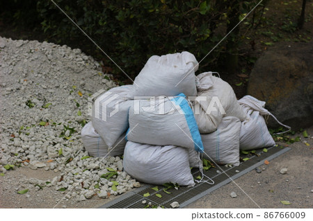 Sandbags for river flood control. Flood measures. Sandbags for river flood control. Flood measures. 86766009