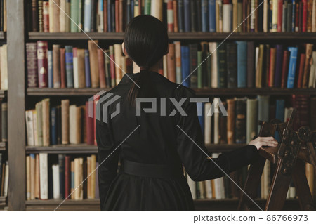 Woman in the library Woman in the library 86766973