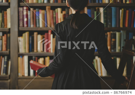 Woman in the library Woman in the library 86766974