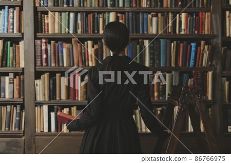 Woman in the library Woman in the library 86766975