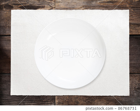 Plate placed on a wooden table Plate placed on a wooden table 86768731