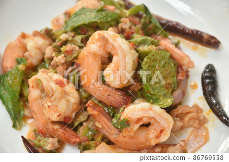 spicy and sour wing bean slice with chop pork topping boiled shrimp Thai salad on dish spicy and sour wing bean slice with chop pork topping boiled shrimp Thai salad on dish 86769558