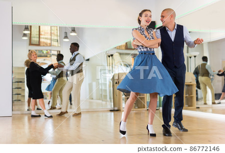 Adult dancing couple enjoying active swing 86772146