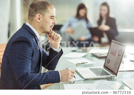 senior Manager at the workplace on the background of business team senior Manager at the workplace on the background of business team 86772538