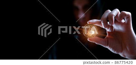 Crypto money bitcoin background. Crypto hacker hand hold golden BTC bit coin. Digital money, stock market concept. Crypto money bitcoin background. Crypto hacker hand hold golden BTC bit coin. Digital money, stock market concept. 86775420