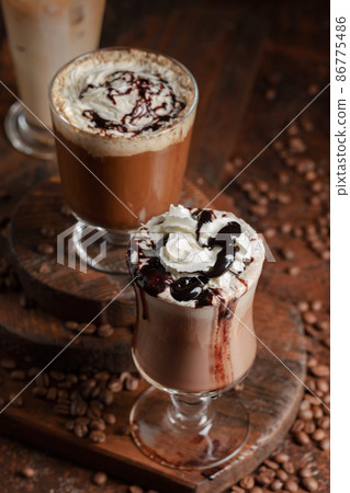 Coffee and chocolate drinks with whipped cream. Coffee and chocolate drinks with whipped cream. 86775486