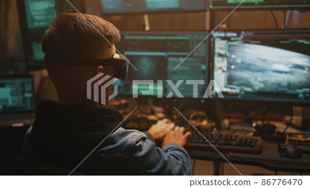 Male hacker launching nuclear warhead 86776470