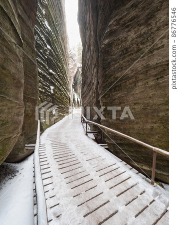 Rocky labyrinth of Adrspach rocky park. Christmas time visit 86776546