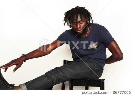 young handsome african american man gesturing emotional posing isolated on white background stylish hipster. youth concept young handsome african american man gesturing emotional posing isolated on white background stylish hipster. youth concept 86777006