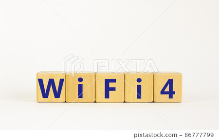 WiFi 4 symbol. The concept word WiFi 4 on wooden cubes. Beautiful white table, white background, copy space. Business, technology and WiFi 4 or WiFi4 concept. WiFi 4 symbol. The concept word WiFi 4 on wooden cubes. Beautiful white table, white background, copy space. Business, technology and WiFi 4 or WiFi4 concept. 86777799