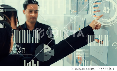Business people in corporate staff meeting with envisional graphic Business people in corporate staff meeting with envisional graphic 86778104